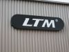 Schwarzes Formtransparenter Leuchtkasten mit weiÃŸer LED beleuchteter Schrift von LTM in MÃ¼nchen